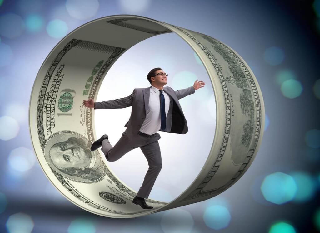 Guy in hamster wheel made of money